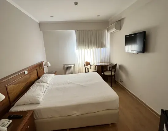 Standard room with double bed and interior views