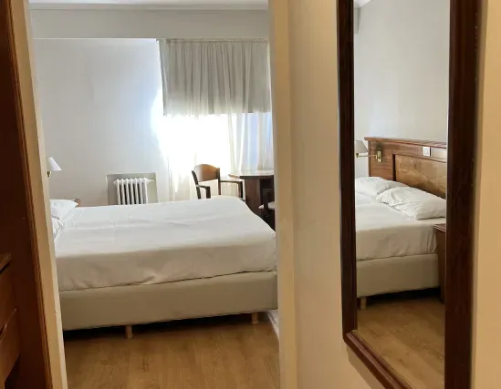 Standard room with double bed and interior views