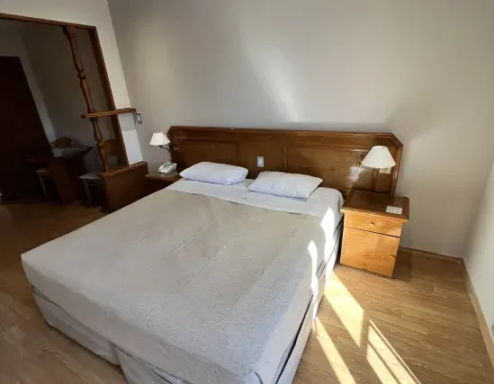 Standard room with double bed and interior views